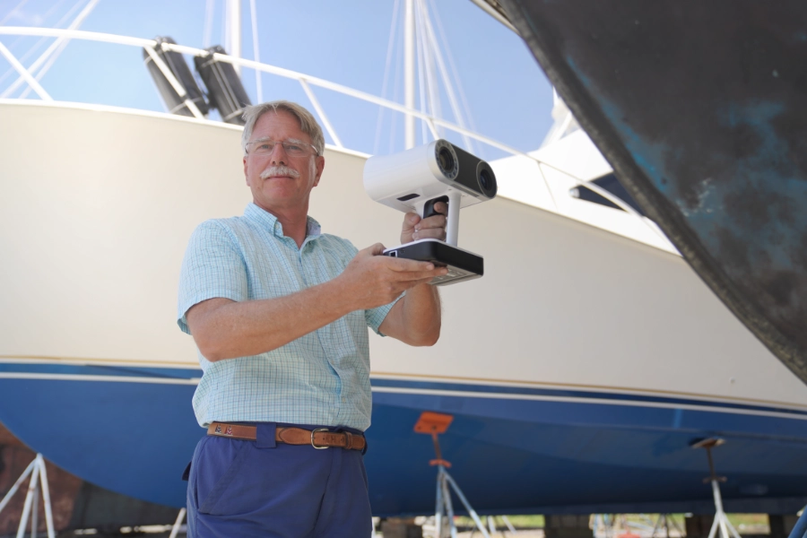 Darryl 3d scanning a car outdoor